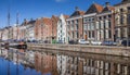 Old ship and warehouses along a canal in Groningen