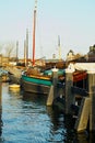 Old ships Dutch River port Leiden city, The Netherlands Historic technology Royalty Free Stock Photo