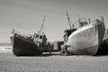 Old ships on a sandy coast