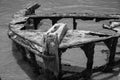 Old shipwreck, Galle Fort, Sri Lanka, Black and white image, rusted remains of fishing vessel on shoreline Royalty Free Stock Photo