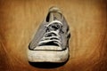 Old shoe with shoelaces worn shabby homeless clothing Royalty Free Stock Photo