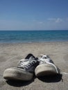 Old Shoes at the beach Royalty Free Stock Photo