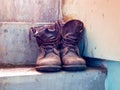 Old shoes placed it on the stair. Royalty Free Stock Photo