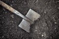 Old shovel in soil