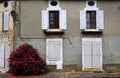 Old shuttered windows and old stonework, France