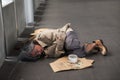 Old sick beggar or Homeless man in city