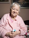 Old sick woman with asthma inhaler Royalty Free Stock Photo