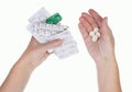 An old sick woman holds pills in her hands, which must be taken Royalty Free Stock Photo