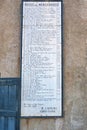 Old sign, from 1879 with list of fees for entering or leaving Lyme Regis harbour.