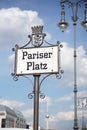 Old signboard with caption Pariser Platz written in old German font as a symbol of central Berlin