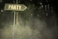 Old signboard with text party near the sinister forest Royalty Free Stock Photo