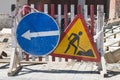 Old signs warning of construction work and detour. Royalty Free Stock Photo