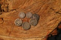 Old silver coins on wooden surface Royalty Free Stock Photo