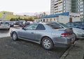 Old silver grey Honda Prelude 2.0 sport car parked under naked trees