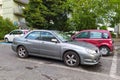 Old silver grey Subaru Impresa private car sedan side view