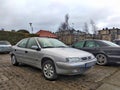 Old silver grey veteran classic French sedan car Citroen Xsara parked