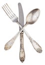 Old silver knife fork and spoon crossed isolated Royalty Free Stock Photo