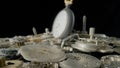 Old silver pocket watch on a pile of gears, gearwheels, cogwheels on black isolated background. Disassembled parts Royalty Free Stock Photo