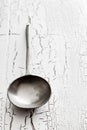 Old silver serving spoon on table Royalty Free Stock Photo