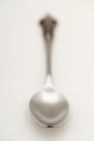 Old silver spoon on table Royalty Free Stock Photo