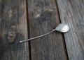 Old silver spoon on wooden table Royalty Free Stock Photo