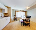 Old simple white and wood kitchen interior with carpet floor Royalty Free Stock Photo