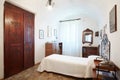 Old, single bedroom in ancient interior