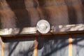 An old a single light bulb and lamp outdoor at front wall door of house, closeup Royalty Free Stock Photo