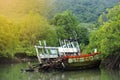 Old Sink fishing boat dock dead along mangrove canal river fores Royalty Free Stock Photo