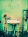 Old sink on a delapidated wall