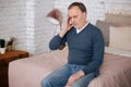 Old sitting man with headache Royalty Free Stock Photo