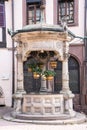 Old six-bucket well, Obernai, Alsace, France Royalty Free Stock Photo