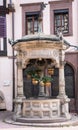 Old six-bucket well, Obernai, Alsace, France Royalty Free Stock Photo