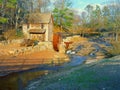 Old Sixes mill by a stream near Atlanta, Georgia, with a vintage truck parked nearby