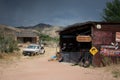 Old  a sixth generation Ford F-Series tow truck near a mechanic shop on the desert road Royalty Free Stock Photo