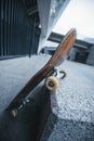 old skateboard leaning at corner of Royalty Free Stock Photo