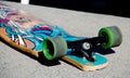 Old skateboard on a sidewalk at Alki beach Royalty Free Stock Photo