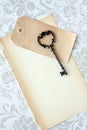 Old skeleton key and paper Royalty Free Stock Photo