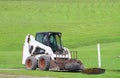 Old skid loader parked on a farms field