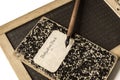 An old slate, a penholder and exercise book Royalty Free Stock Photo