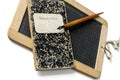 An old slate, penholder and exercise book, to learn write. Royalty Free Stock Photo