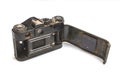 Old SLR camera rusted from falling into the water, on a white isolated background Royalty Free Stock Photo