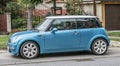 Old small blue car Mini Cooper parked left side view Royalty Free Stock Photo