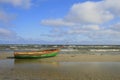 Old small boat lying on the beach Royalty Free Stock Photo