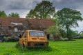 Old small car on a poor village