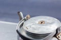 Old small classic kettle on the table in thai restaurant