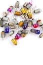 Old small colored light bulbs on a white background Royalty Free Stock Photo
