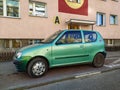 Old small compact city car Fiat Seicento parked.