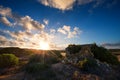 Old small deserted house in field with cloud sunset landscape Royalty Free Stock Photo