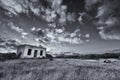 Old small deserted house in field with cloud sunset landscape ar